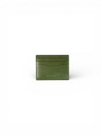 Green leather cardholder on a white background